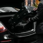 chauffeur-helping-with-luggage-fleet